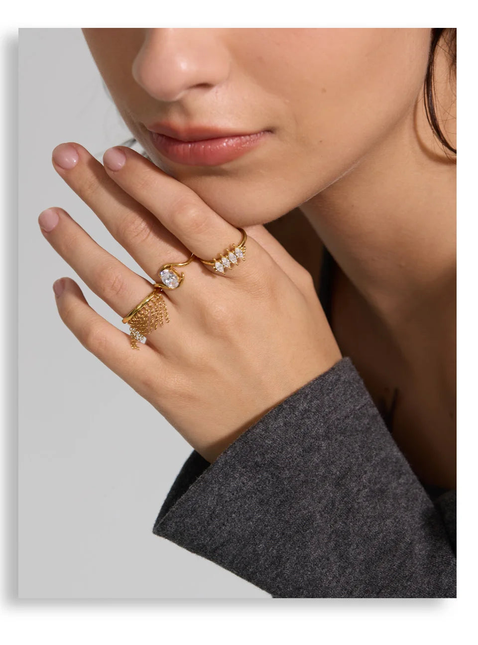 Cubic zirconia geometric ring in 18K gold-plated stainless steel with cubic zirconia.