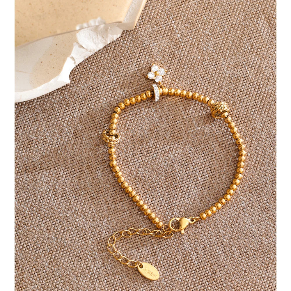 Cubic Zirconia Flower Beaded Bracelet — Gold-Plated Stainless Steel with Cubic Zirconia · PS1066