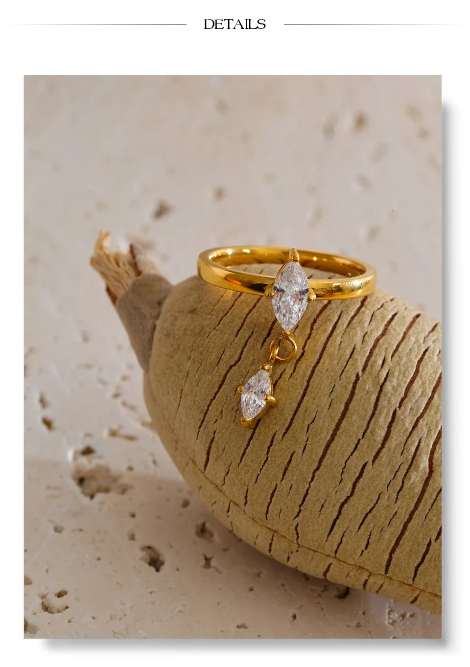 Cubic zirconia geometric ring in 18K gold-plated stainless steel with cubic zirconia.