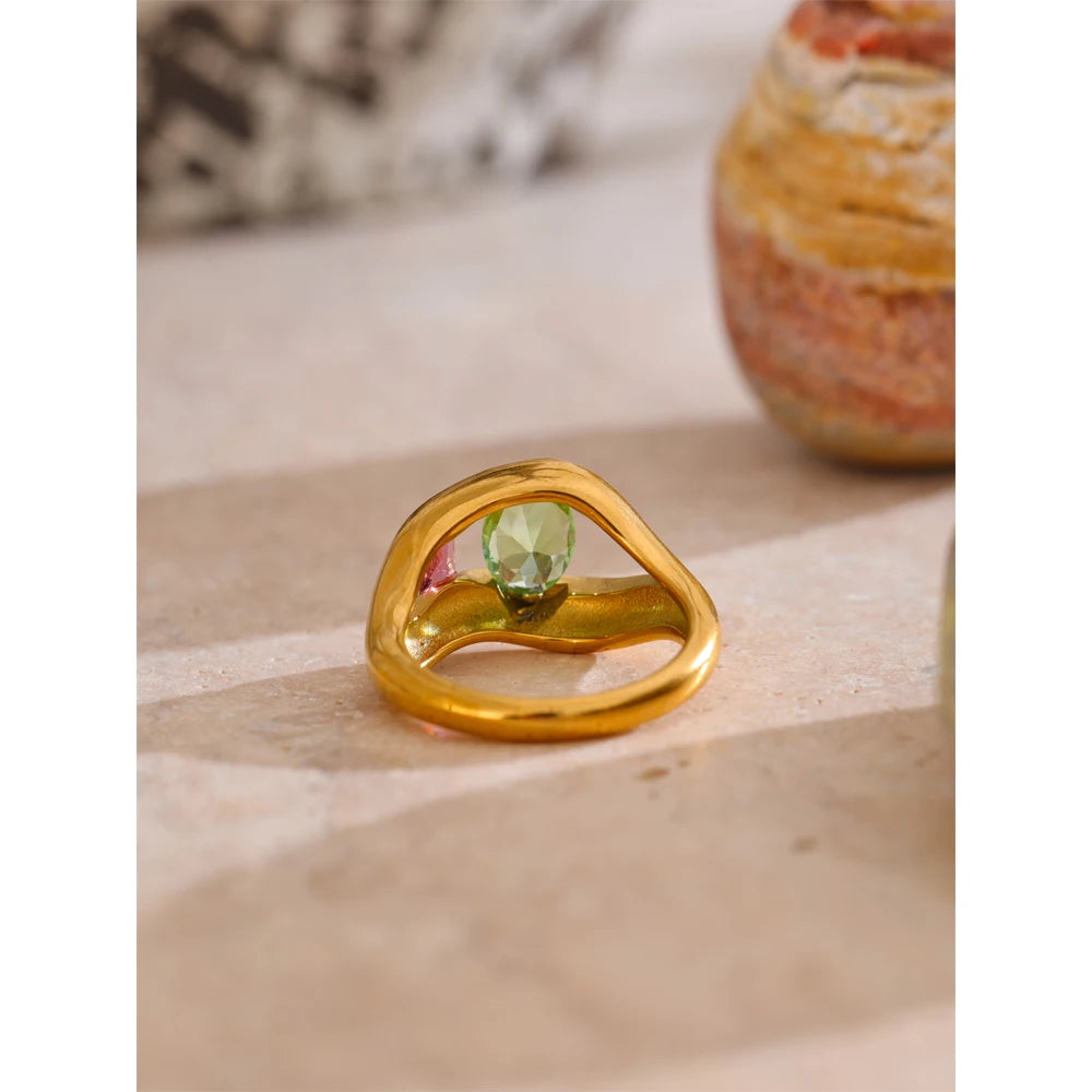 Cubic zirconia geometric ring in 18K gold-plated stainless steel with cubic zirconia.
