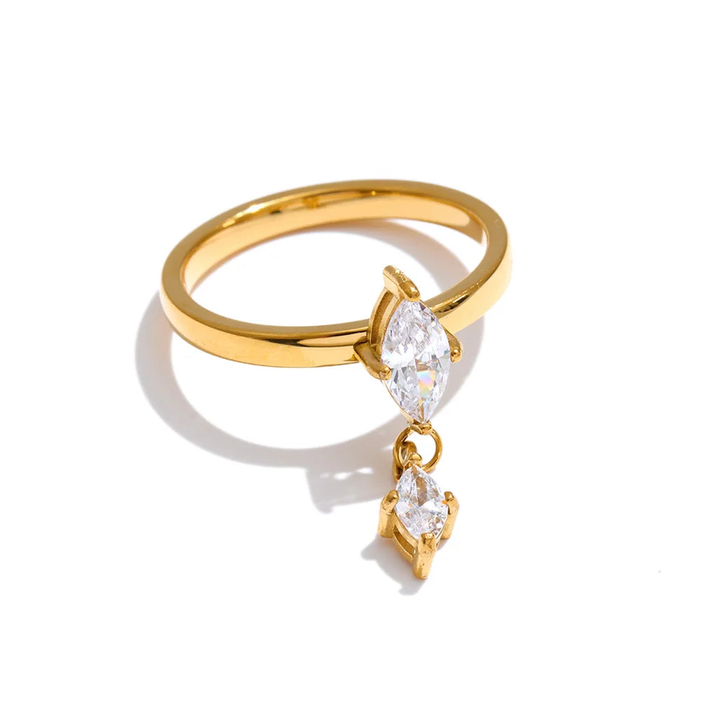 Cubic zirconia geometric ring in 18K gold-plated stainless steel with cubic zirconia.