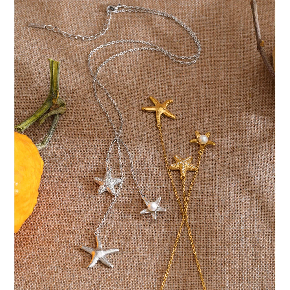 Cubic zirconia pearl shell necklace in gold-plated stainless steel with pearl and cubic zirconia.