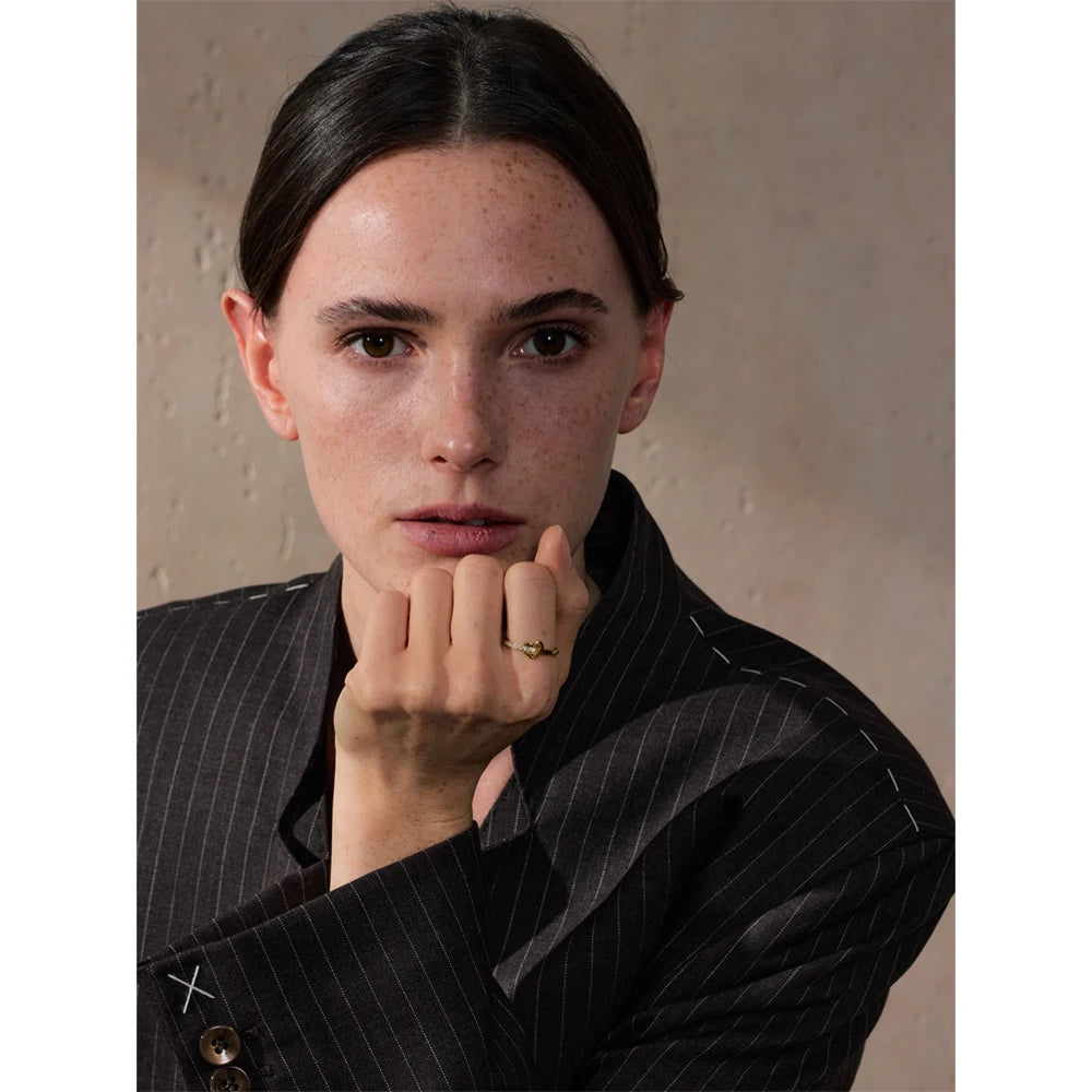Cubic zirconia heart cross ring in 18K gold-plated stainless steel with cubic zirconia.