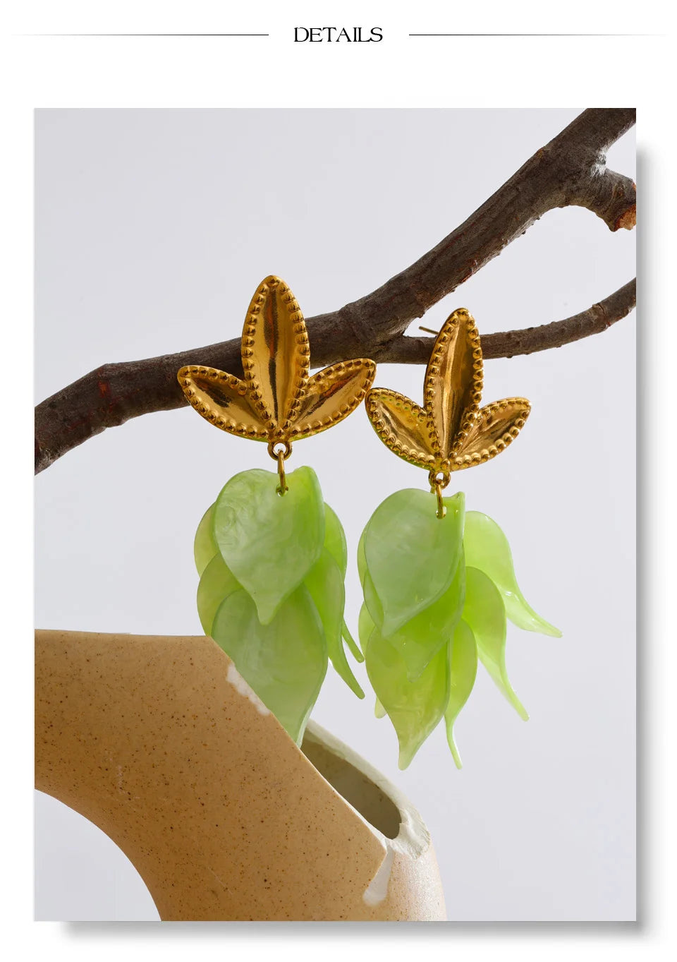 White resin acrylic earrings in gold-plated stainless steel with resin and acrylic.