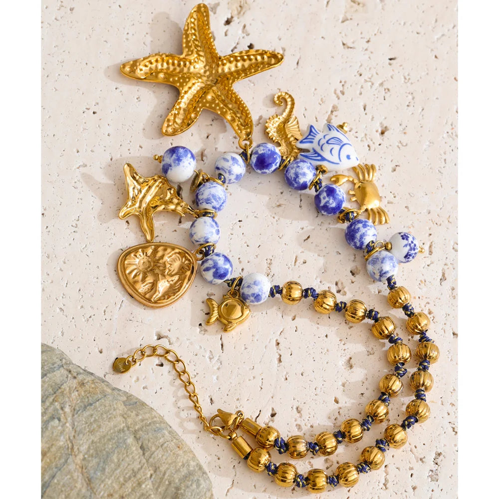 Star beaded geometric necklace in gold-plated stainless steel.