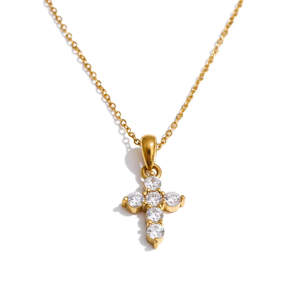 Cubic zirconia cross necklace in gold-plated stainless steel with cubic zirconia.