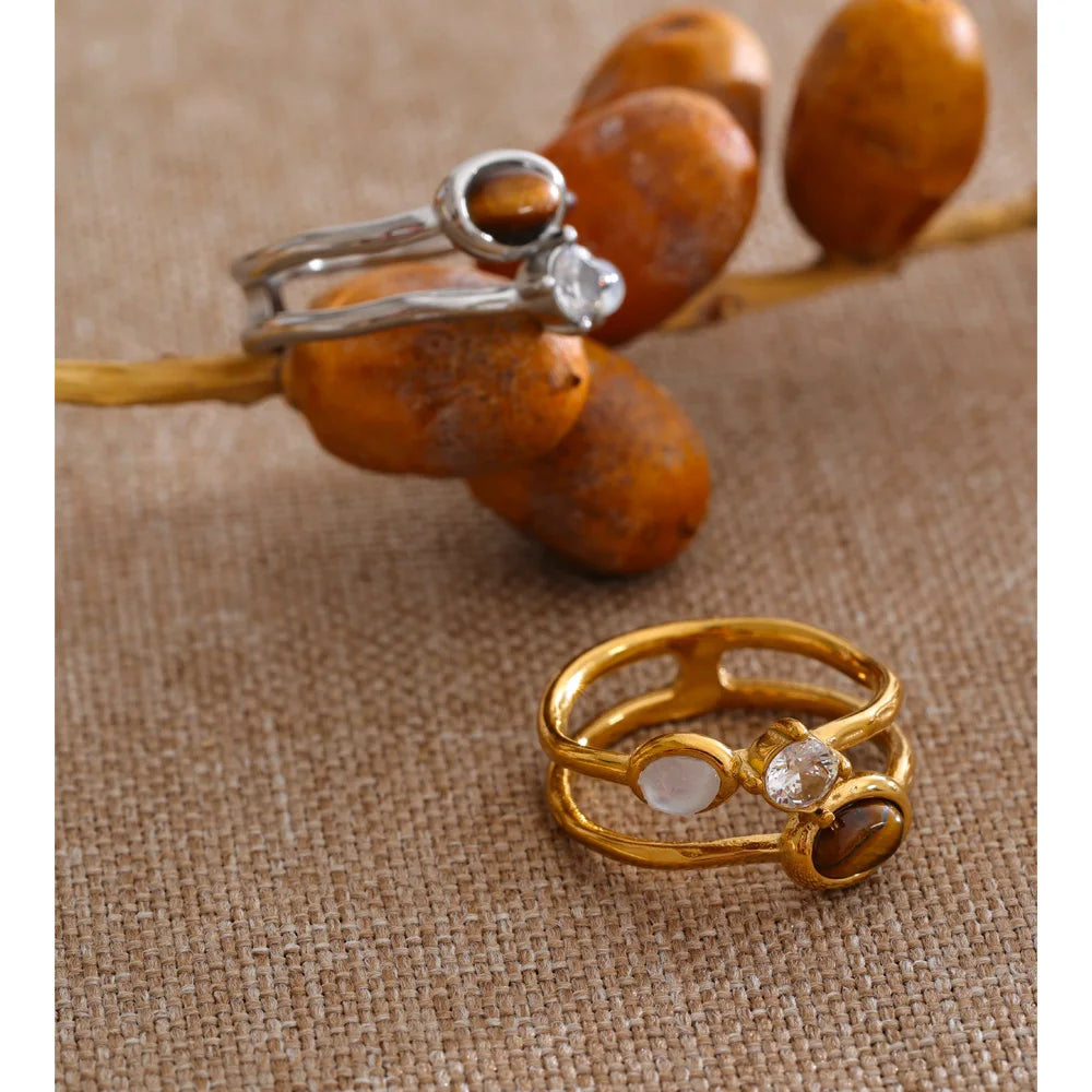 Cubic zirconia natural stone geometric ring in 18K gold-plated stainless steel with cubic zirconia and natural stone.