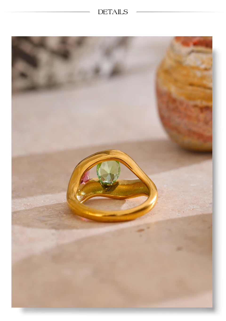 Cubic zirconia geometric ring in 18K gold-plated stainless steel with cubic zirconia.