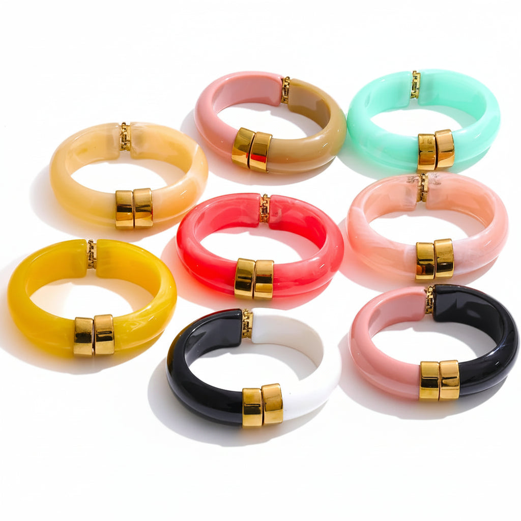 Bracelet set with gold-plated stainless steel bands and resin accents.