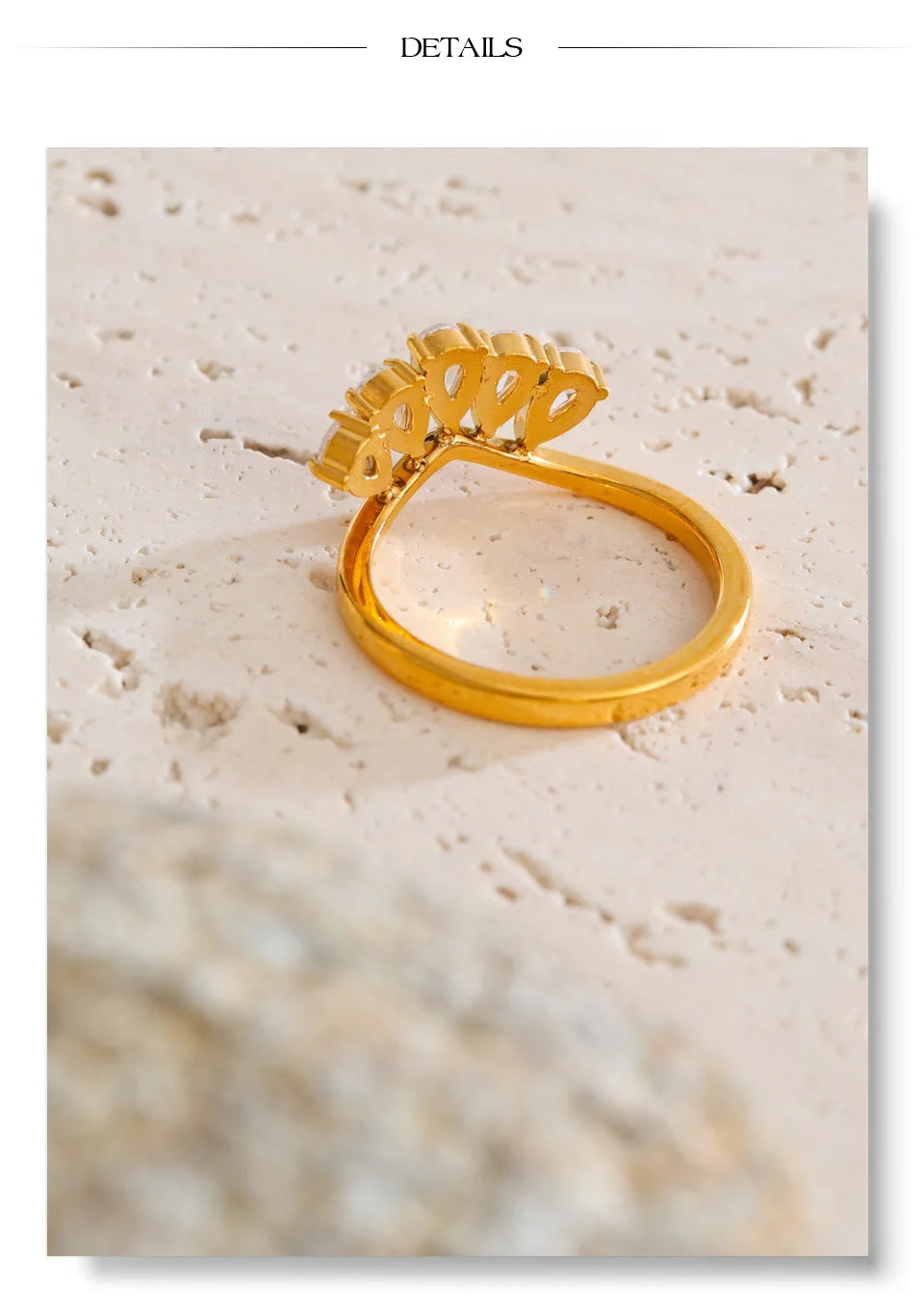 Cubic zirconia flower geometric ring in 18K gold-plated stainless steel with cubic zirconia.