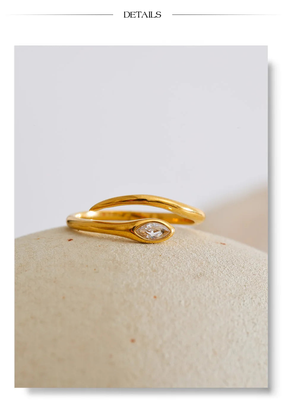 Cubic zirconia snake geometric ring in 18K gold-plated stainless steel with cubic zirconia.