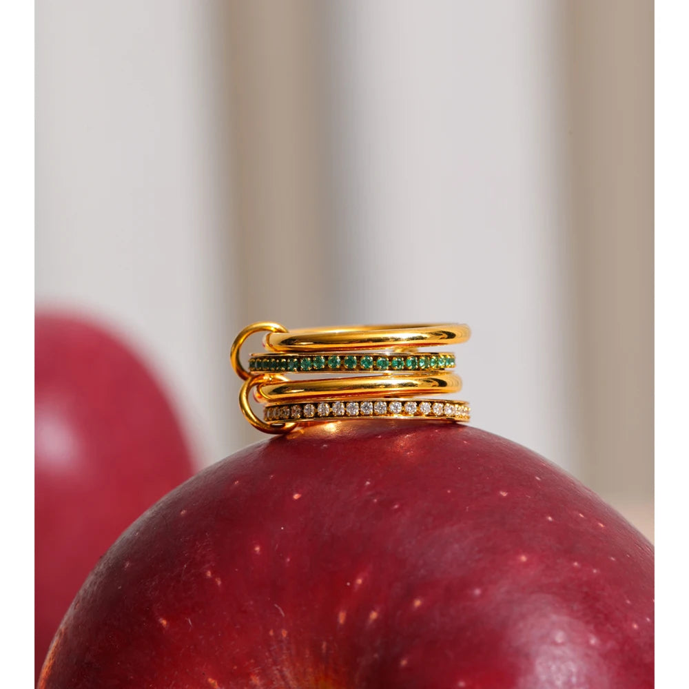 White cubic zirconia geometric ring in 18K gold-plated stainless steel with cubic zirconia.