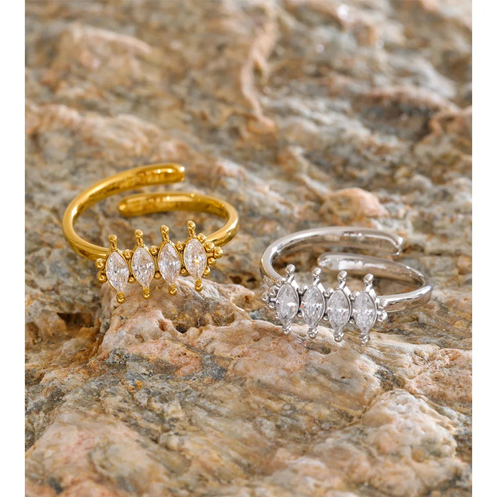 Cubic zirconia geometric ring in 18K gold-plated stainless steel with cubic zirconia.