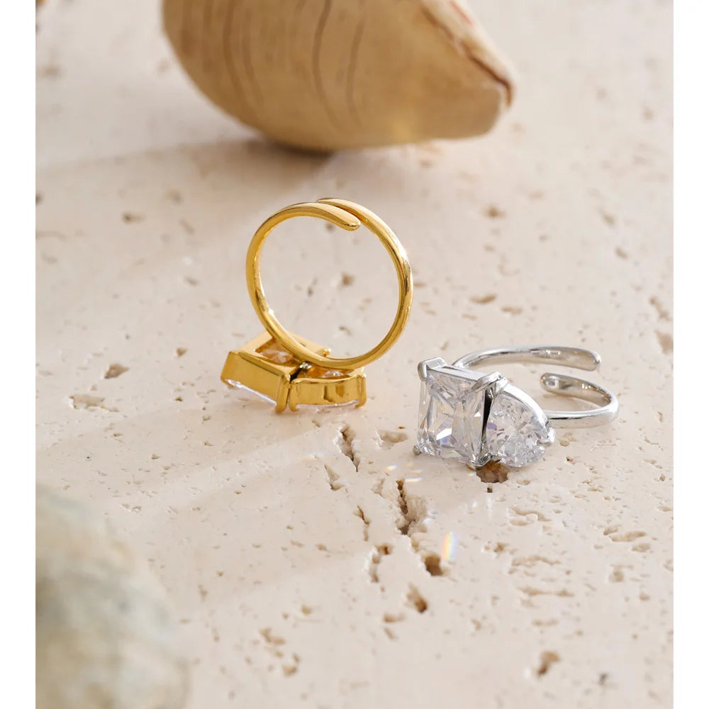 Cubic zirconia geometric ring in 18K gold-plated stainless steel with cubic zirconia.