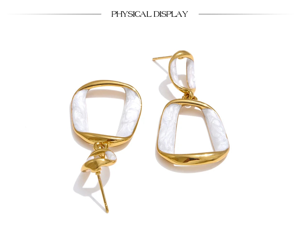 White enamel geometric earrings in gold-plated stainless steel with enamel.