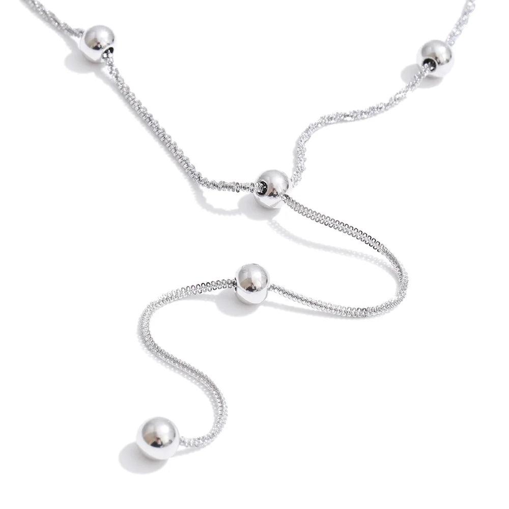 Beaded geometric chain necklace in gold-plated stainless steel.