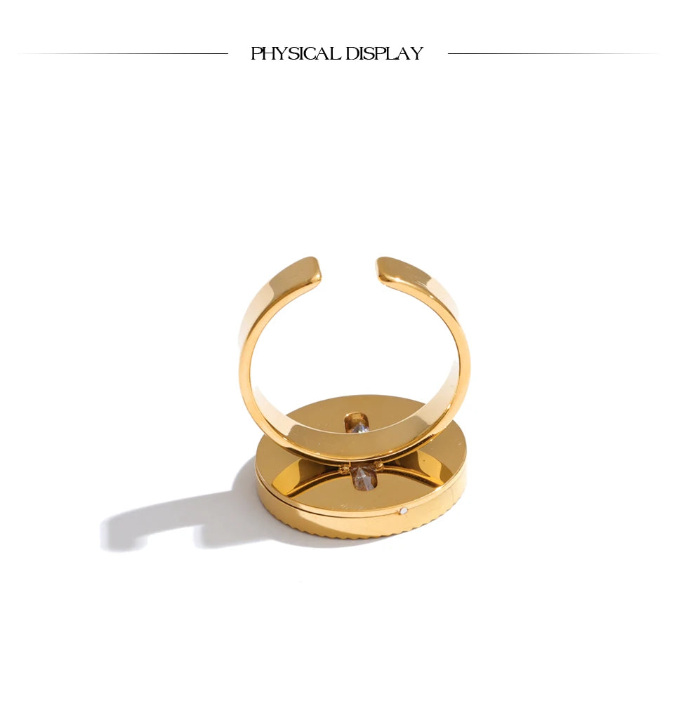 Cubic zirconia geometric ring in 18K gold-plated stainless steel with cubic zirconia.