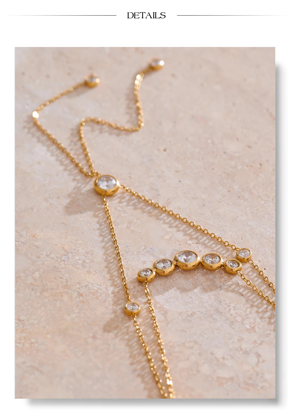 Cubic zirconia geometric chain necklace in gold-plated stainless steel with cubic zirconia.
