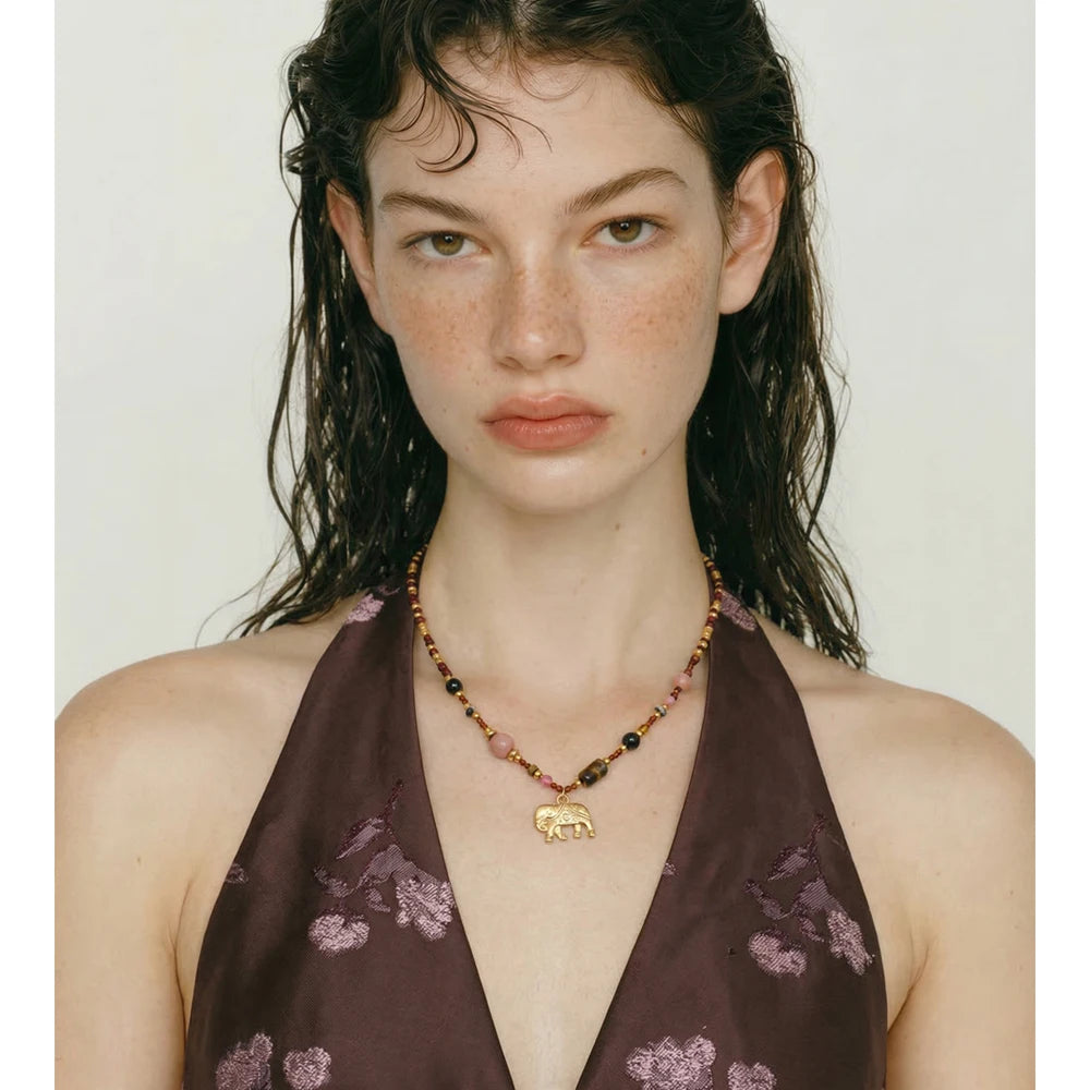 Natural stone beaded chain necklace in gold-plated stainless steel with natural stone.