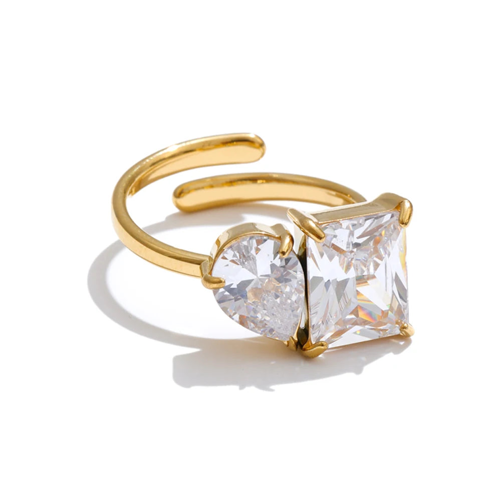 Cubic zirconia geometric ring in 18K gold-plated stainless steel with cubic zirconia.
