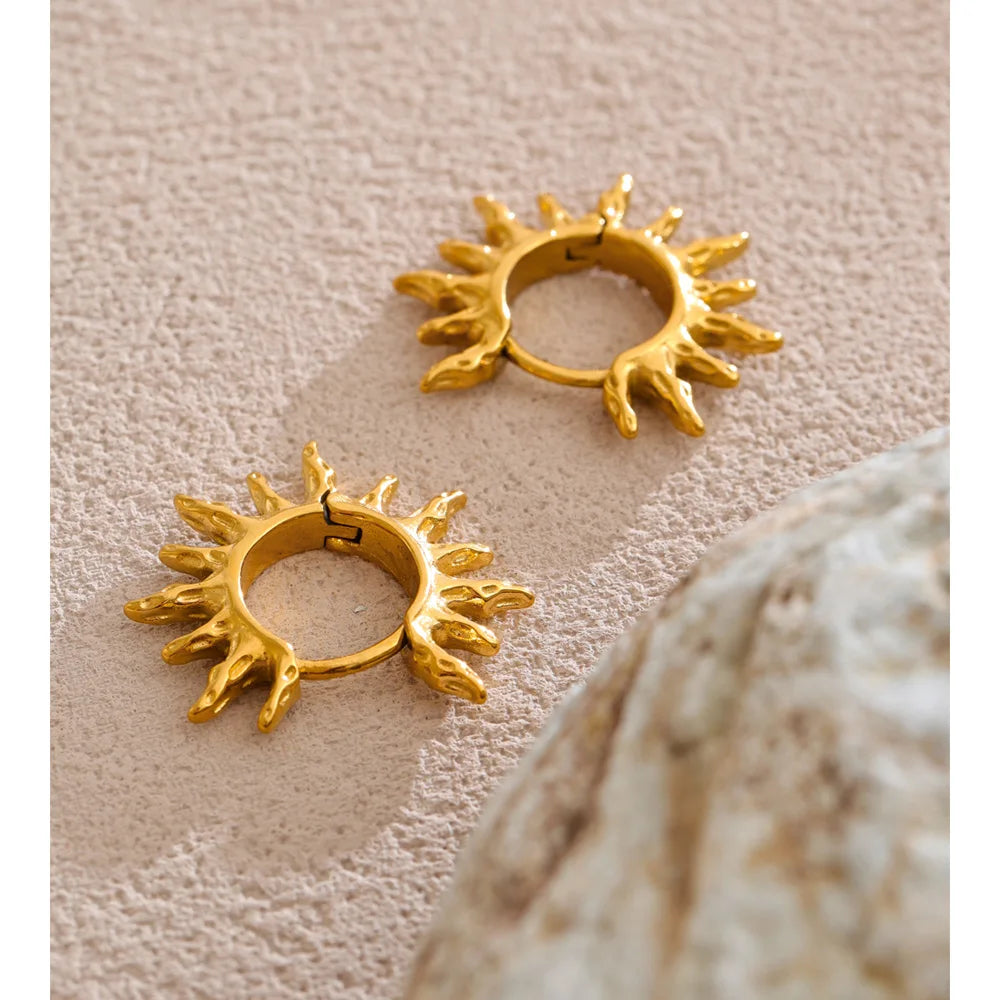 Star sun hammered earrings in gold-plated stainless steel.