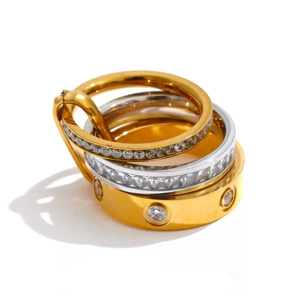 Gold-plated stainless steel ring with cubic zirconia stones.