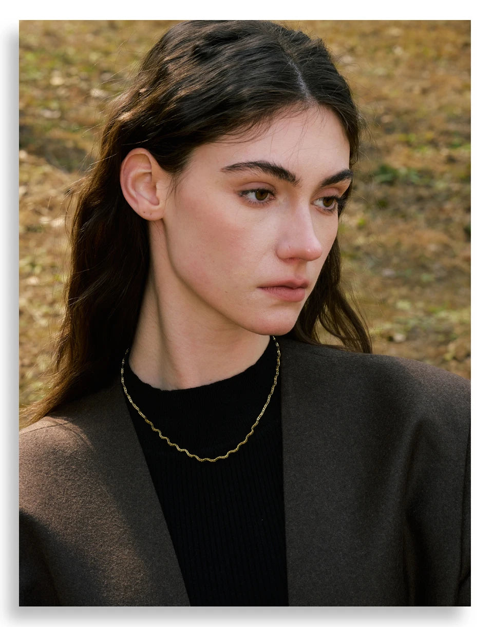 Geometric chain necklace in gold-plated stainless steel.