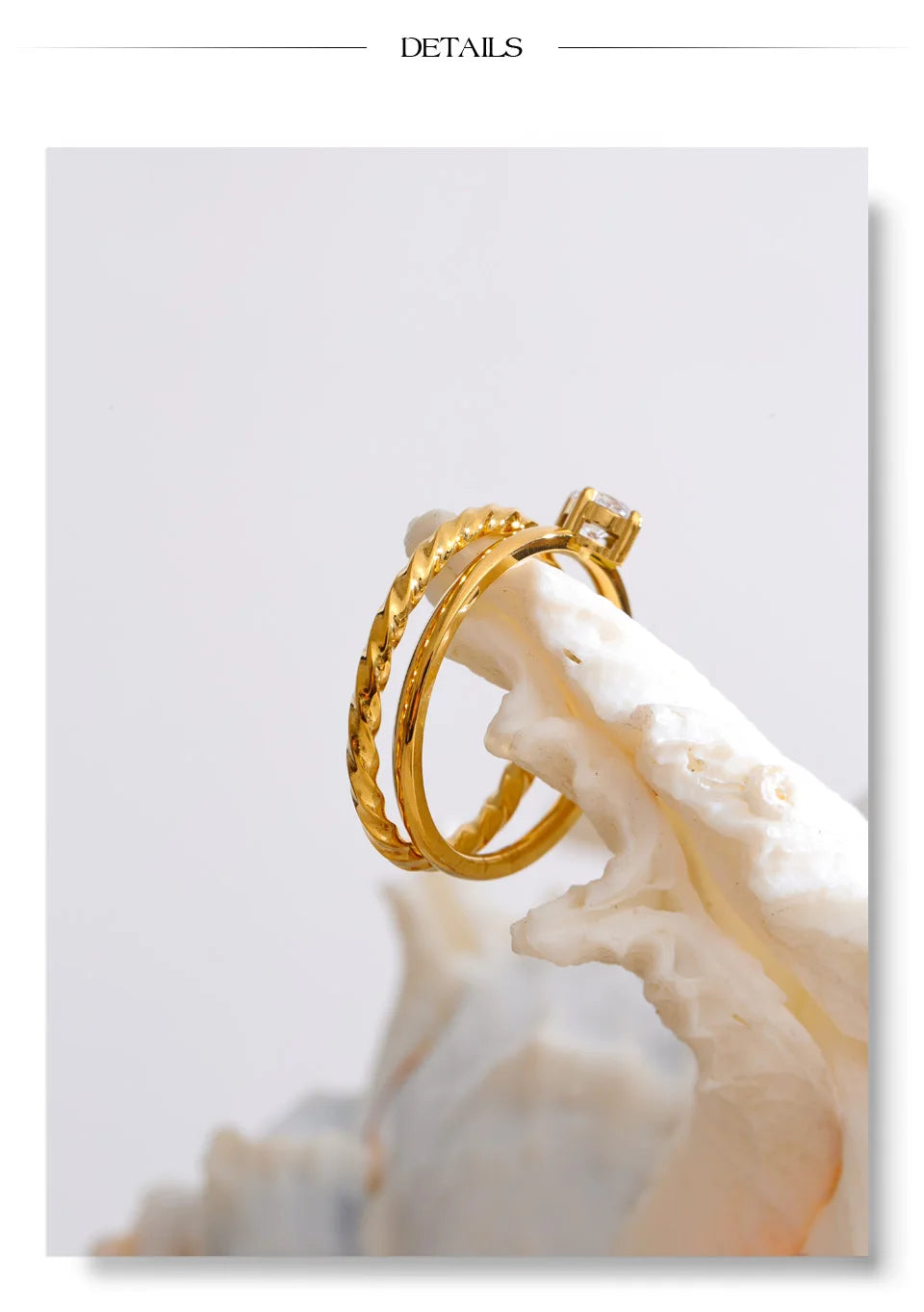 Cubic zirconia geometric ring in gold-plated stainless steel with cubic zirconia.