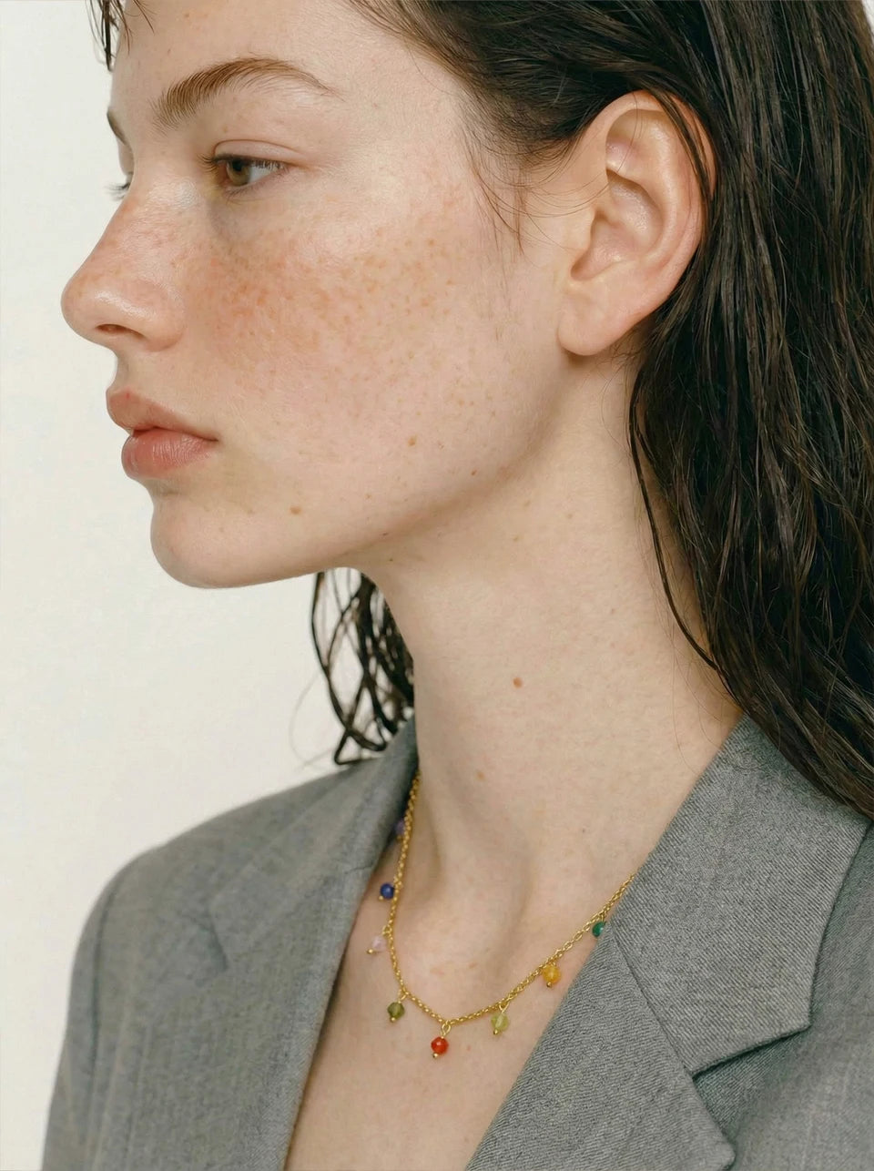 Cubic zirconia multi-color geometric necklace in gold-plated stainless steel with cubic zirconia.