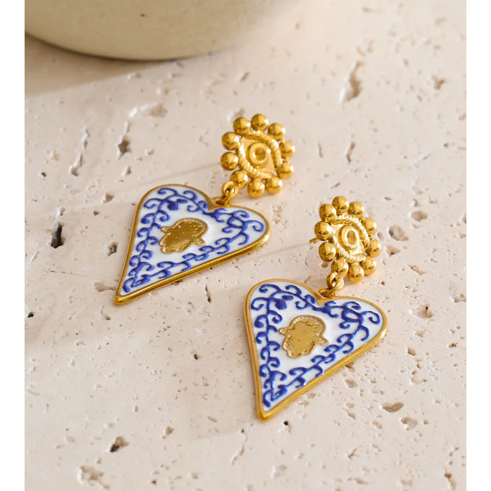 Blue enamel heart earrings in gold-plated stainless steel with enamel.