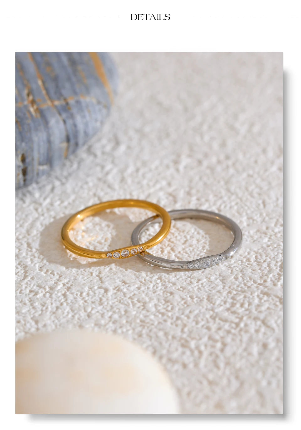 Cubic zirconia geometric ring in 18K gold-plated stainless steel with cubic zirconia.