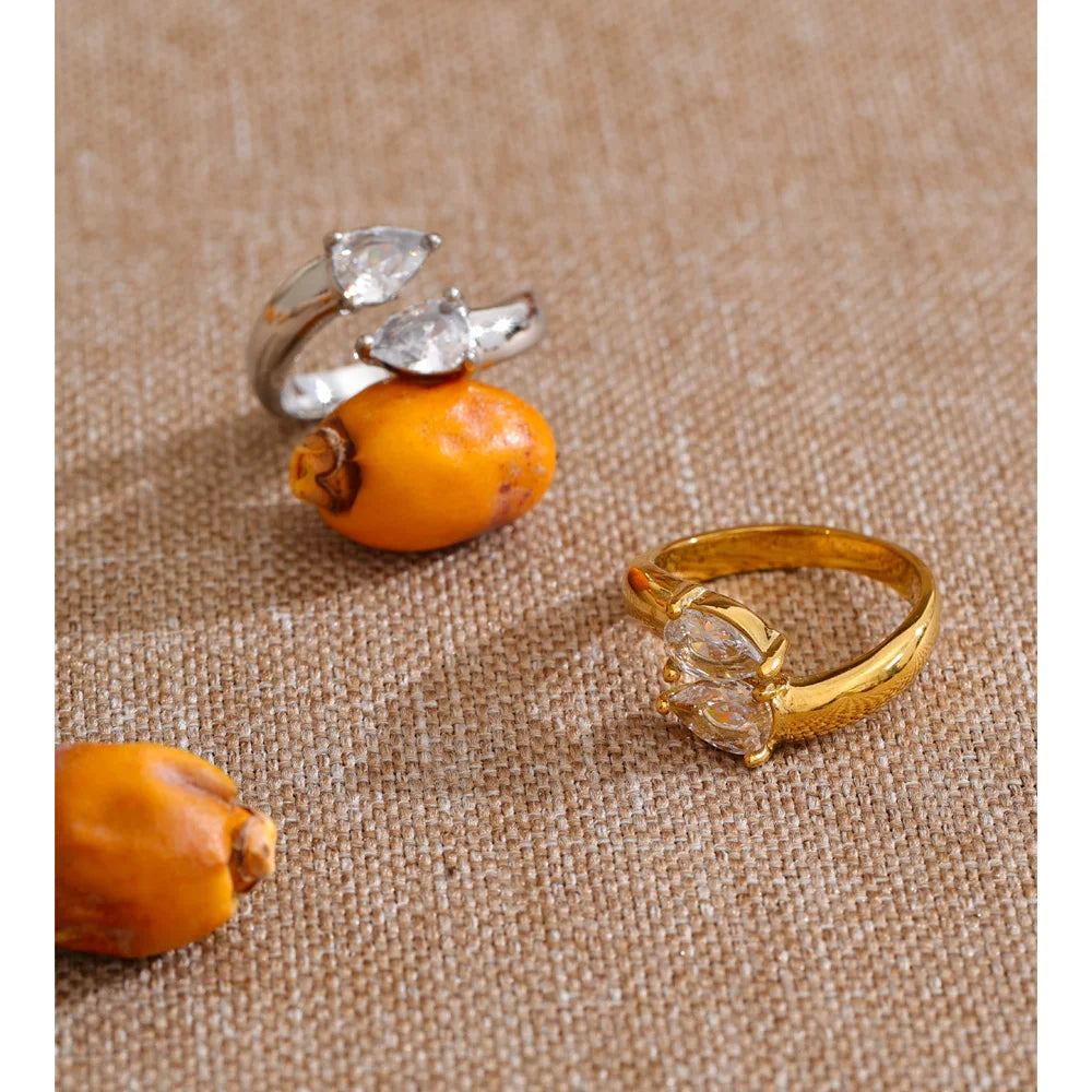 Cubic zirconia geometric ring in 18K gold-plated stainless steel with cubic zirconia.