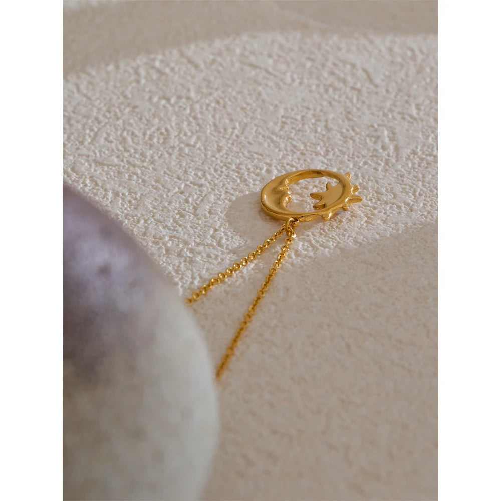 Star moon necklace in gold-plated stainless steel.