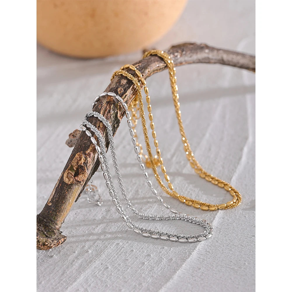 Geometric chain layered necklace in gold-plated stainless steel.