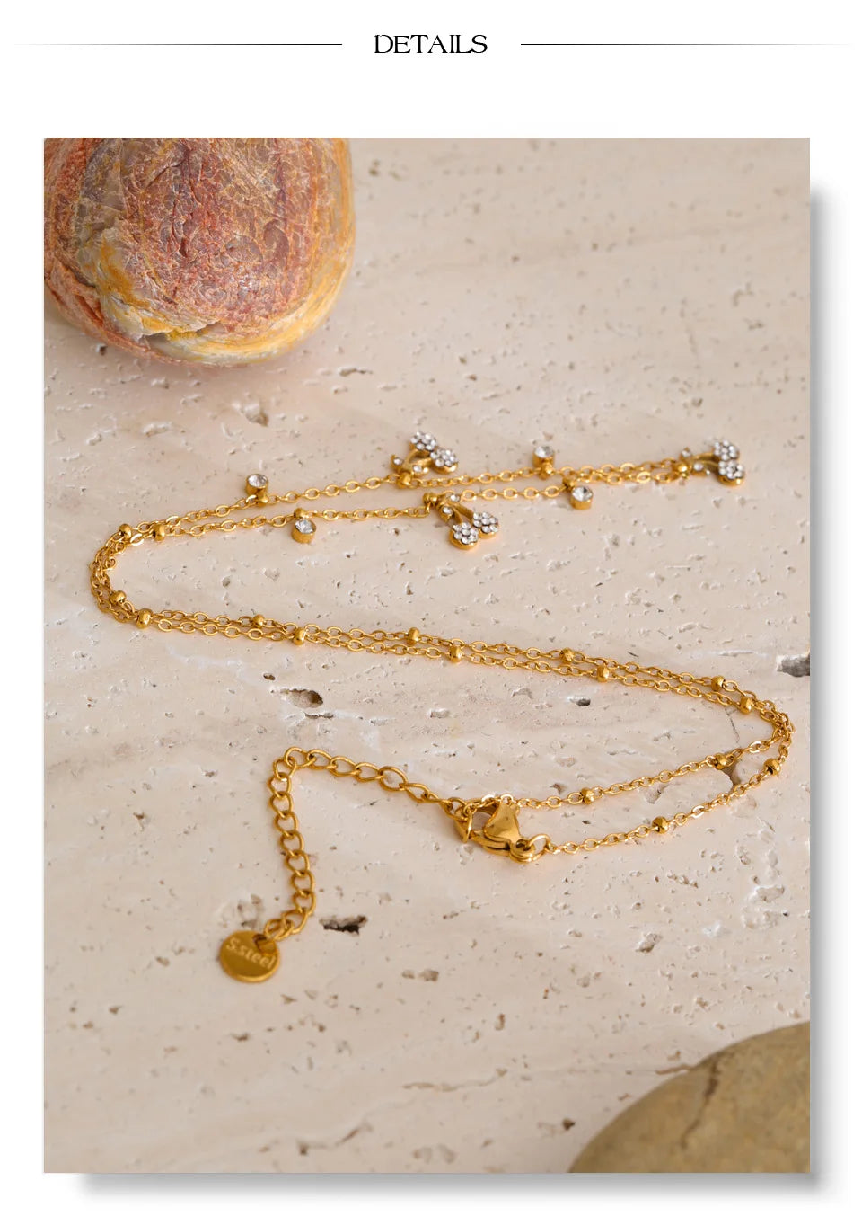 Cubic zirconia geometric necklace in gold-plated stainless steel with cubic zirconia.