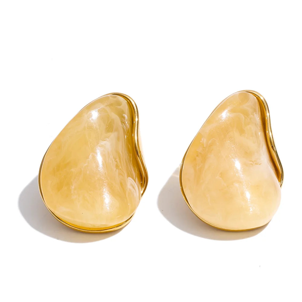 Red resin acrylic earrings in gold-plated stainless steel with resin and acrylic.