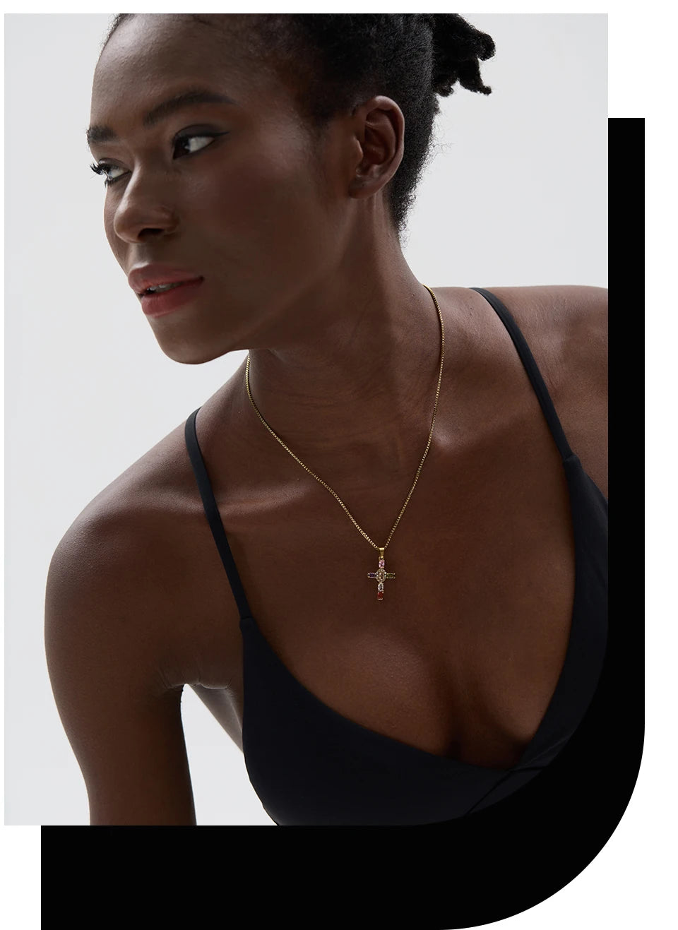 Cubic zirconia cross multi-color necklace in gold-plated stainless steel with cubic zirconia.