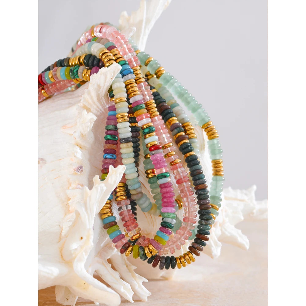 Natural stone beaded multi-color necklace in gold-plated stainless steel with natural stone.