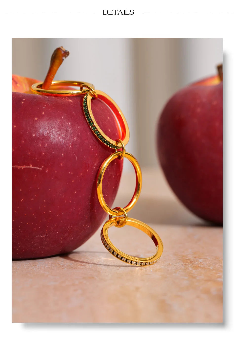 White cubic zirconia geometric ring in 18K gold-plated stainless steel with cubic zirconia.