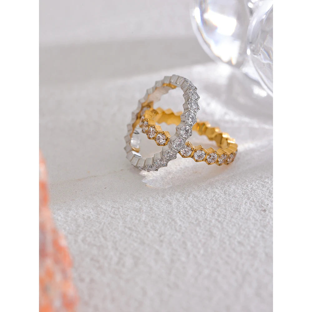 White cubic zirconia geometric ring in gold-plated stainless steel with cubic zirconia.