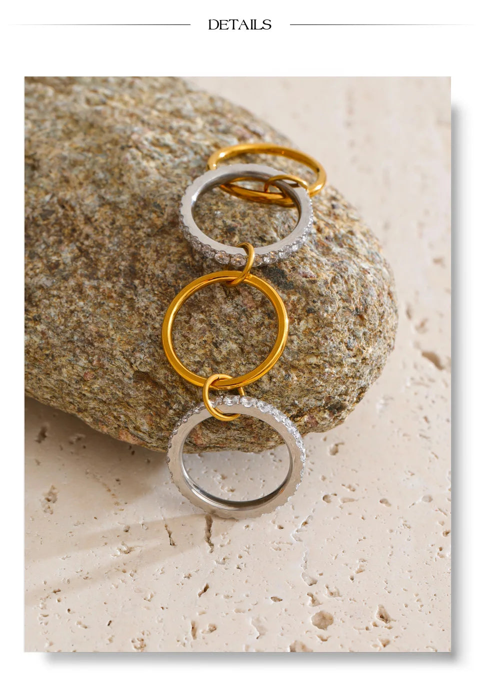 Cubic zirconia geometric layered ring in 18K gold-plated stainless steel with cubic zirconia.