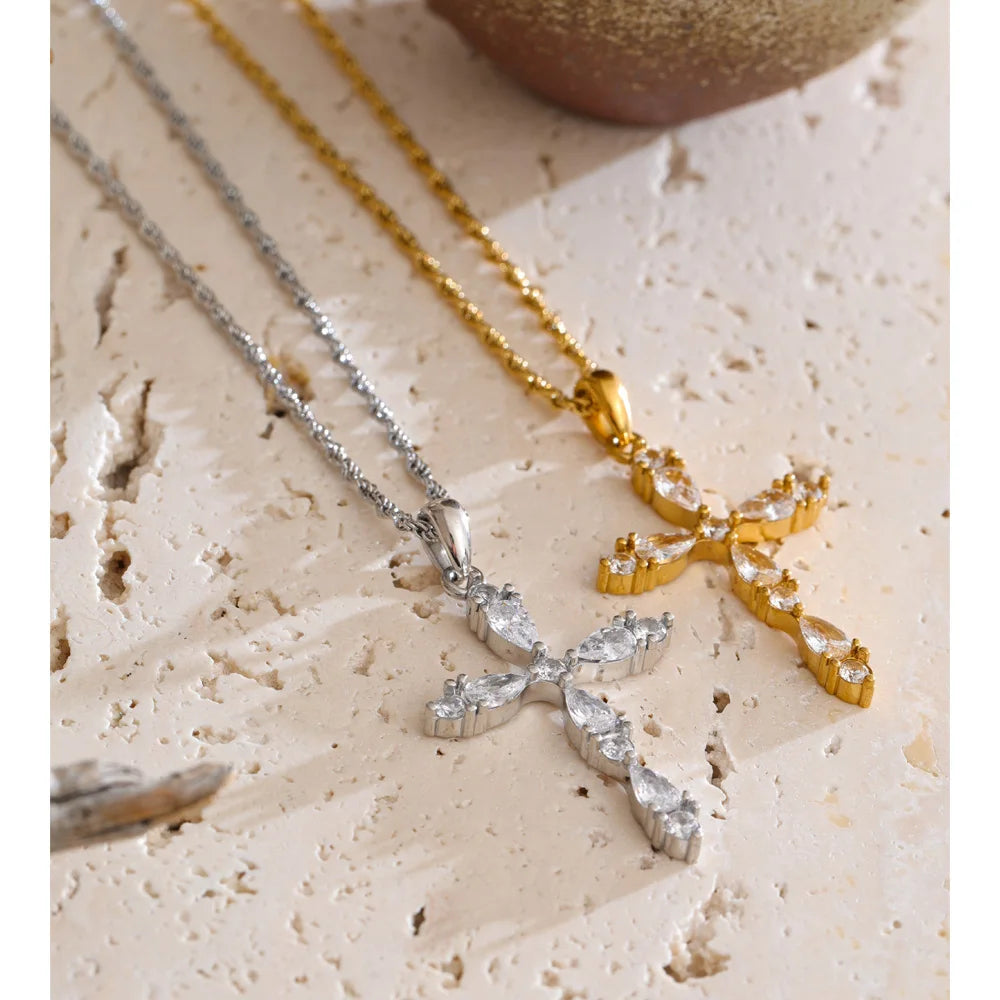 Cubic zirconia cross necklace in gold-plated stainless steel with cubic zirconia.