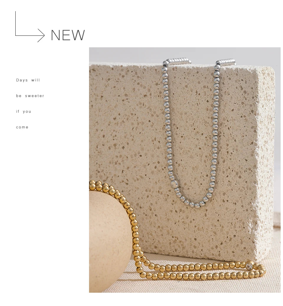 Cubic zirconia beaded geometric necklace in 18K gold-plated stainless steel with cubic zirconia.