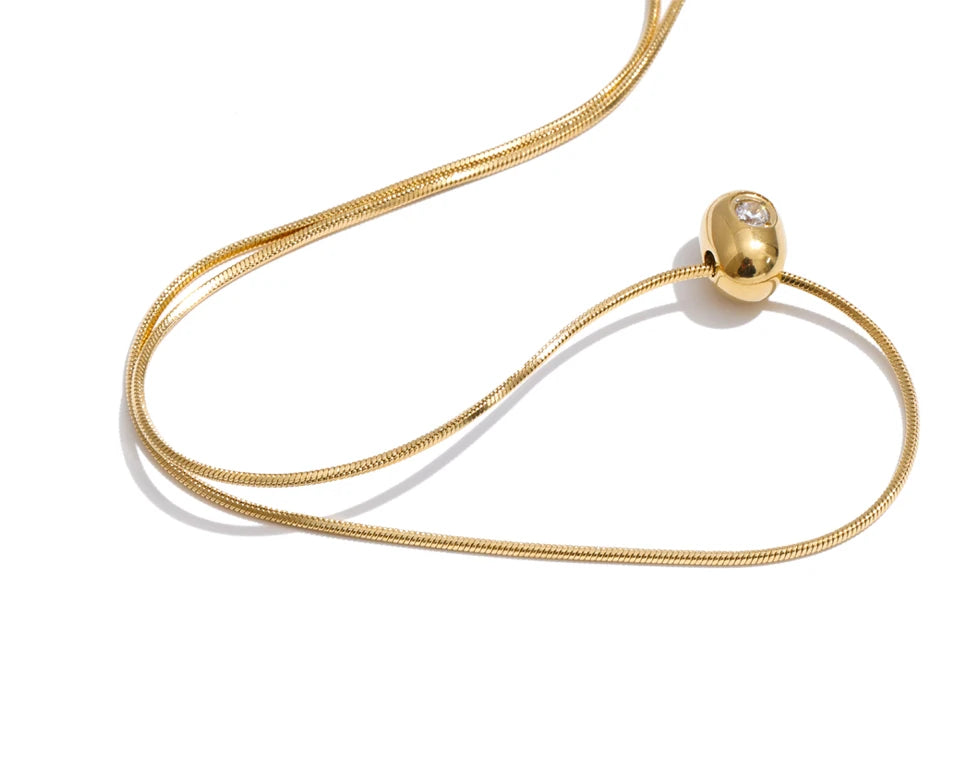 Cubic zirconia geometric necklace in gold-plated stainless steel with cubic zirconia.