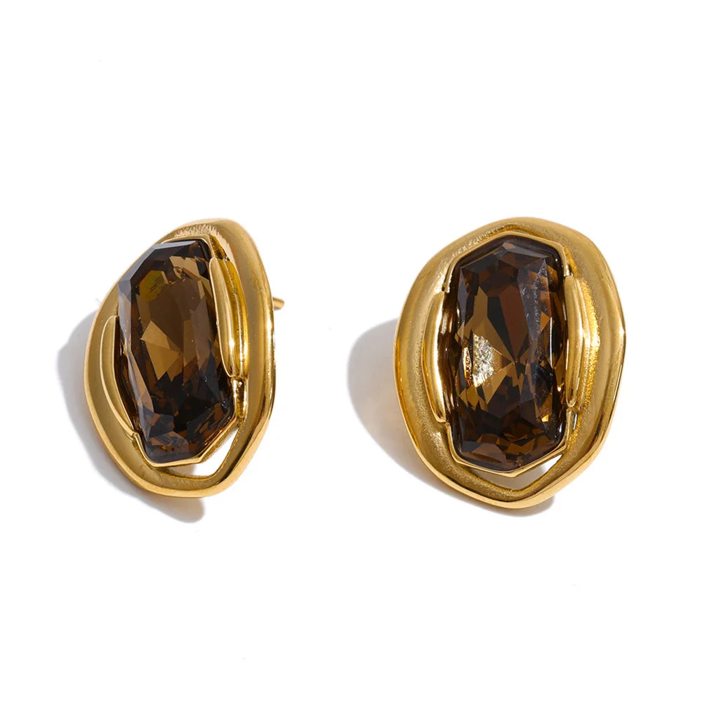 White cubic zirconia geometric earrings in gold-plated stainless steel with cubic zirconia.