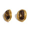 White cubic zirconia geometric earrings in gold-plated stainless steel with cubic zirconia.