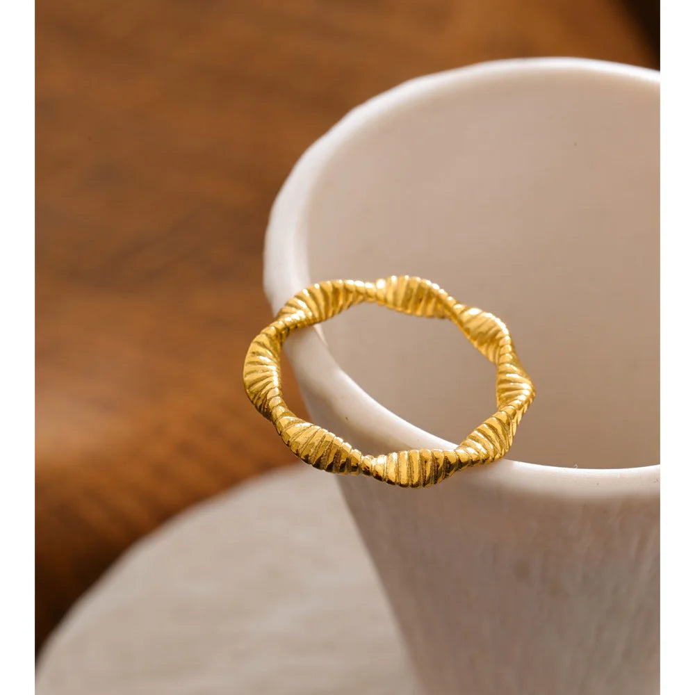 Geometric ring in 18K gold-plated stainless steel.