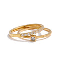 Cubic zirconia geometric ring in 18K gold-plated stainless steel with cubic zirconia.