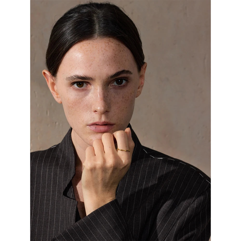 Beaded minimalist geometric ring in 18K gold-plated stainless steel.