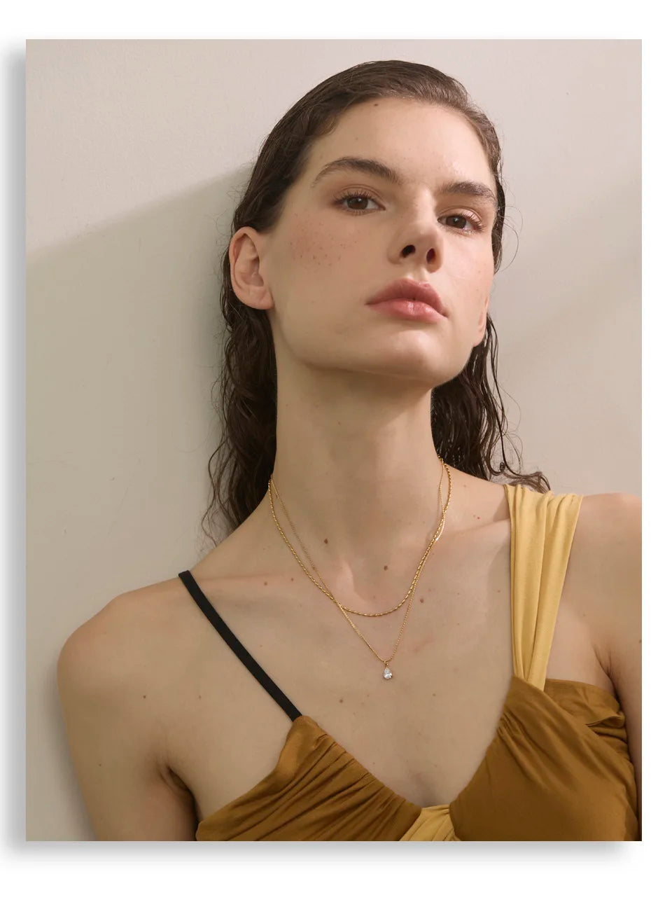 Cubic zirconia geometric layered necklace in gold-plated stainless steel with cubic zirconia.